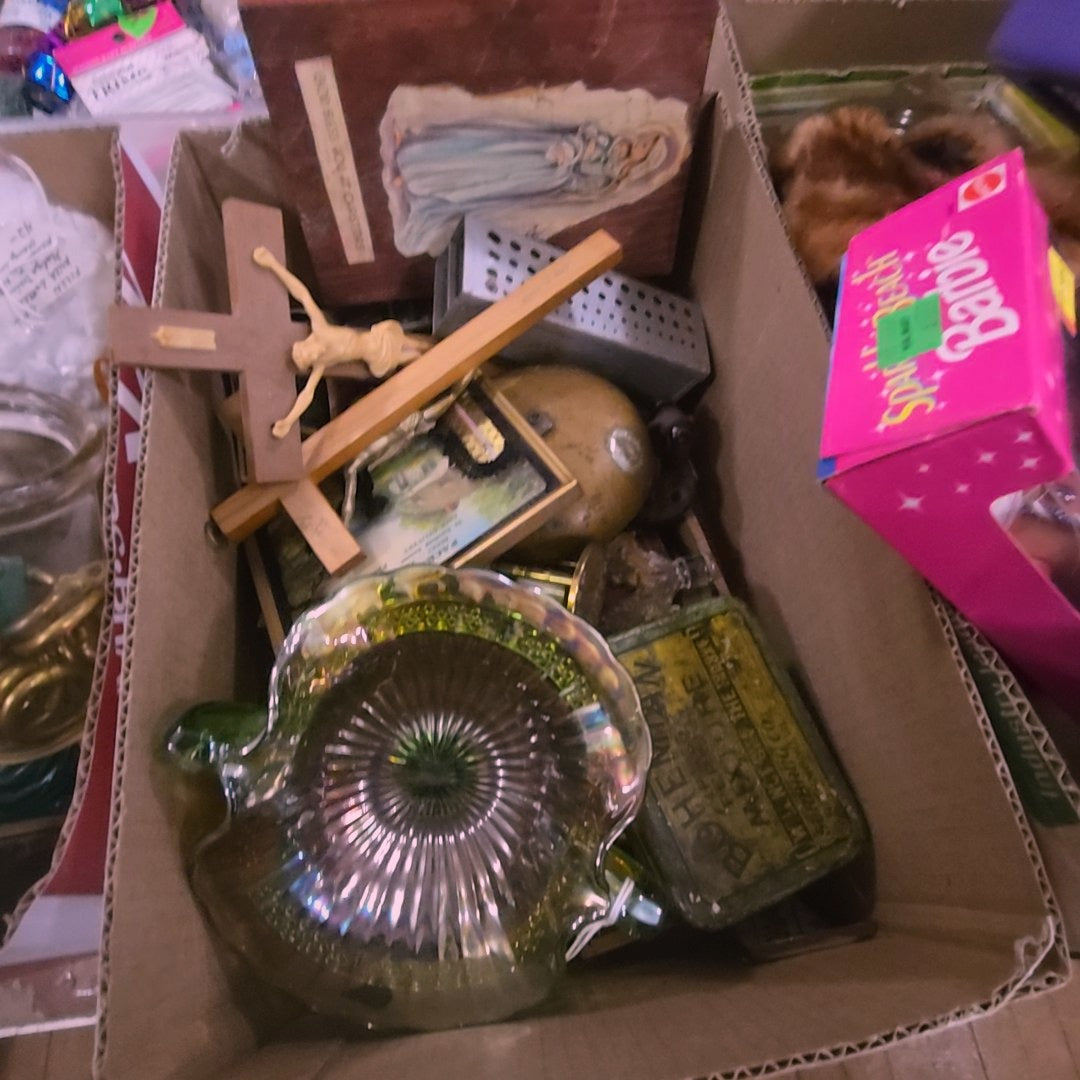 box lot with religious items, tin, and Carnival Glass