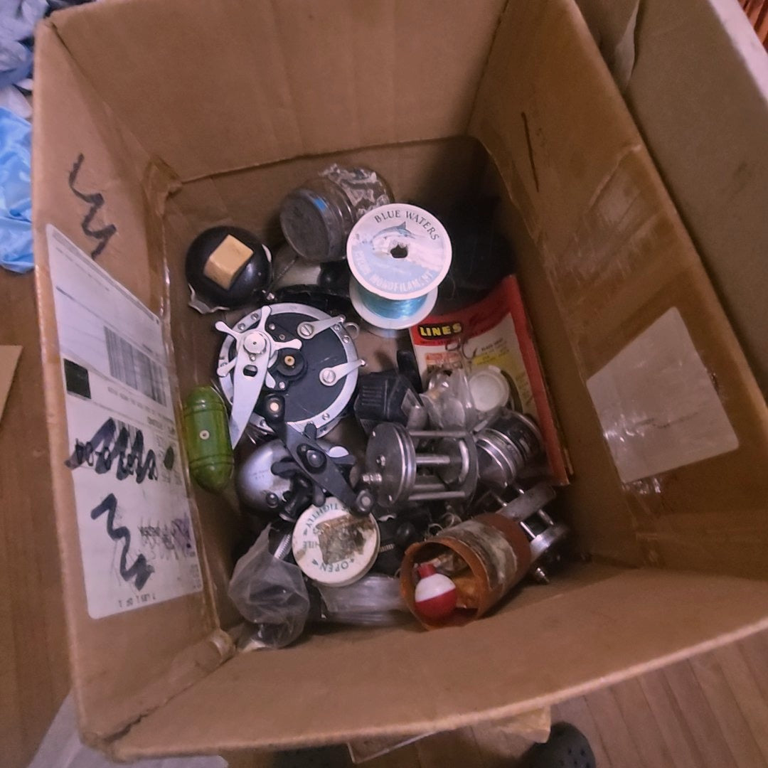 box lot of fishing supplies