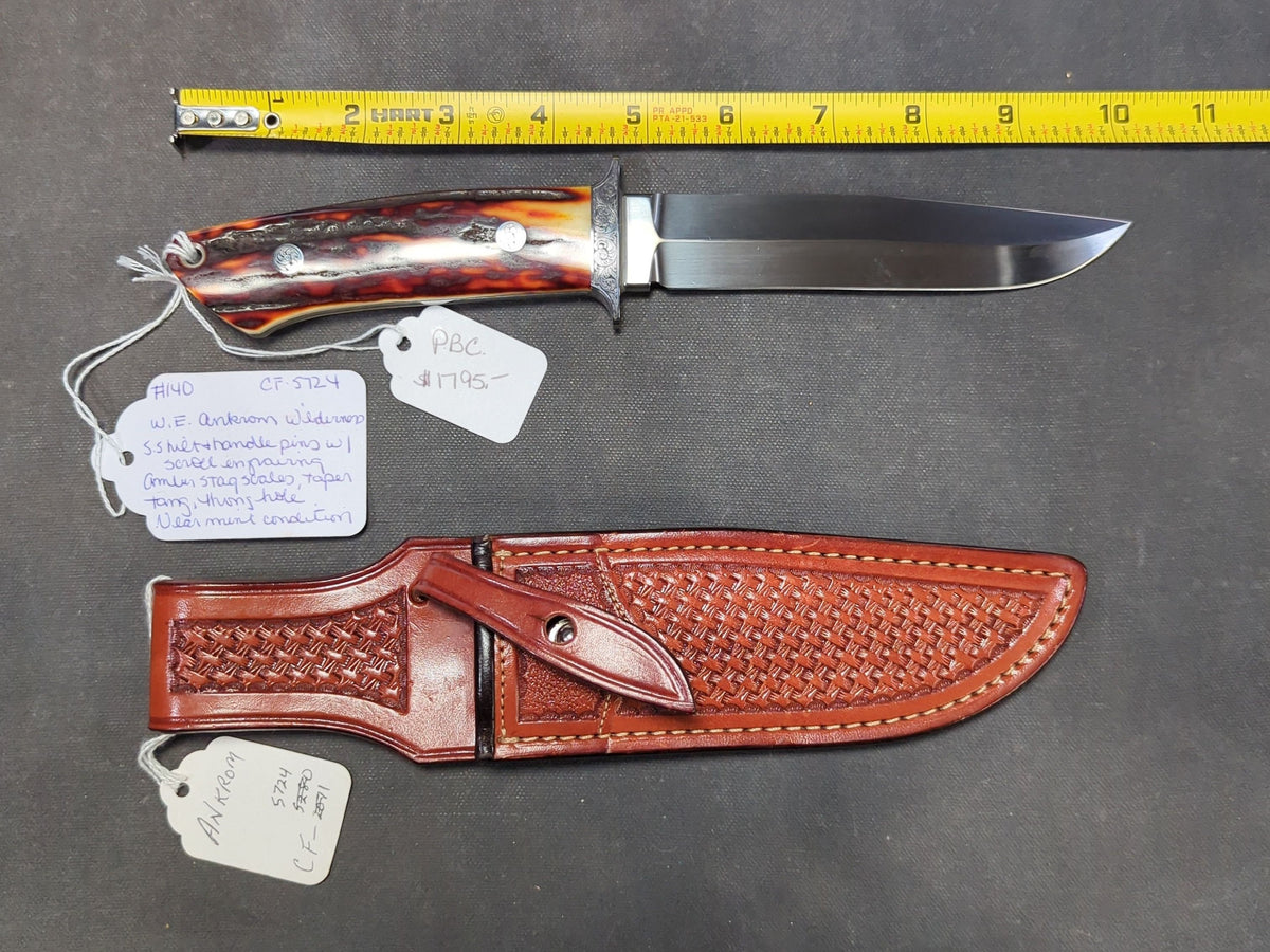 W.E. Ankrom Wilderness Knife, Amber Stag Scales, Stainless Steel Hilt with Scroll Engraving, Tooled Leather Belt Sheath by Paul Long, Kerrville, Texas, Note Fine Crack on Front Side of Handle