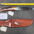 Lot 014 - W.E. Ankrom Wilderness Knife, Amber Stag Scales, Stainless Steel Hilt with Scroll Engraving, Tooled Leather Belt Sheath by Paul Long, Kerrville, Texas, Note Fine Crack on Front Side of Handle