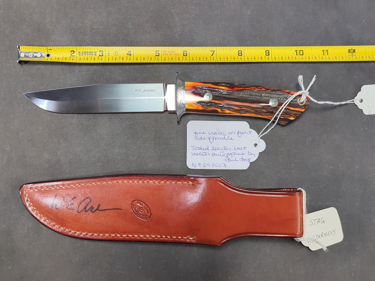 W.E. Ankrom Wilderness Knife, Amber Stag Scales, Stainless Steel Hilt with Scroll Engraving, Tooled Leather Belt Sheath by Paul Long, Kerrville, Texas, Note Fine Crack on Front Side of Handle