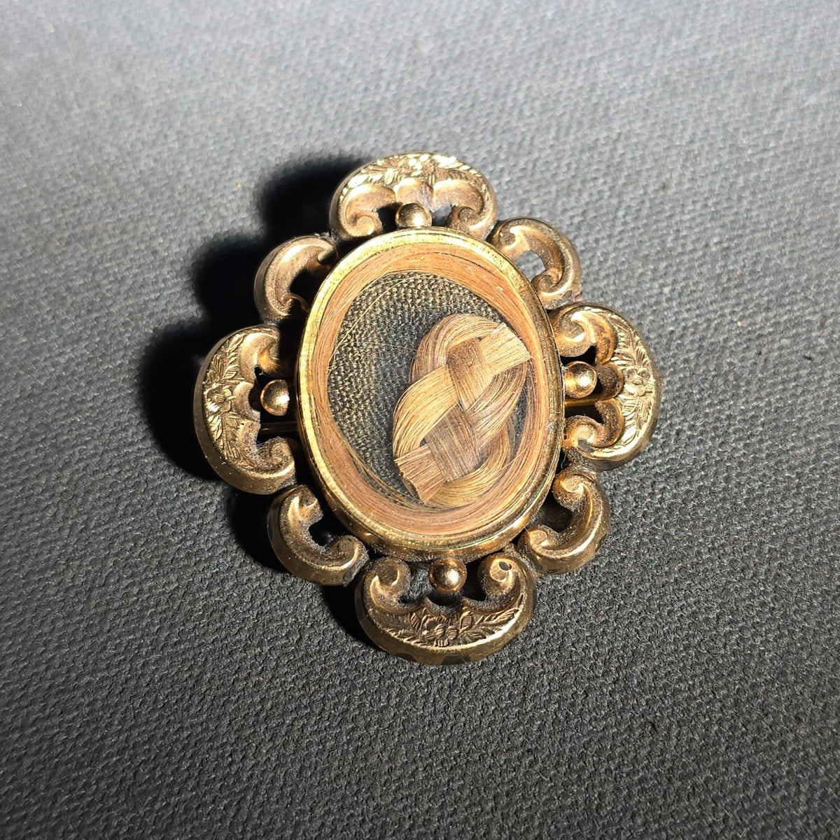 Antique Gold-Tone Hair Work Brooch with Woven Hair Under Glass in Scroll and Floral Frame