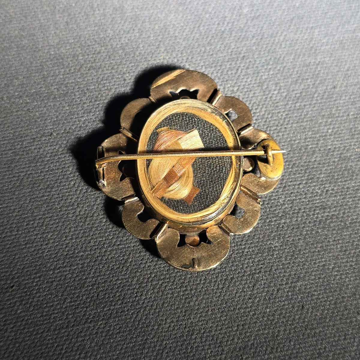 Antique Gold-Tone Hair Work Brooch with Woven Hair Under Glass in Scroll and Floral Frame