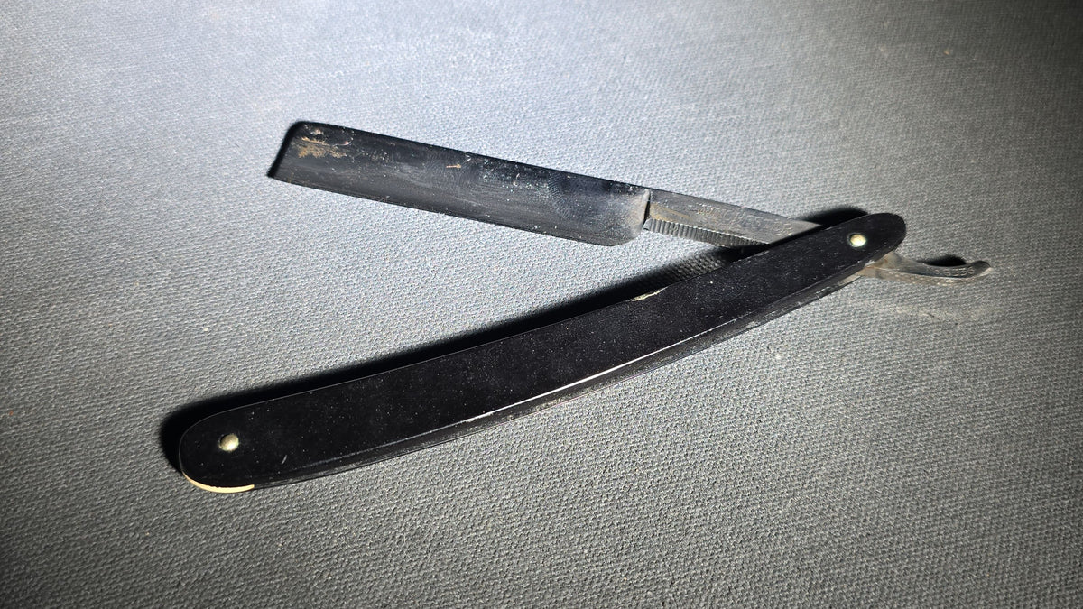Antique Winchester Trade Mark Straight Razor with Black Scales and Brass Wedge