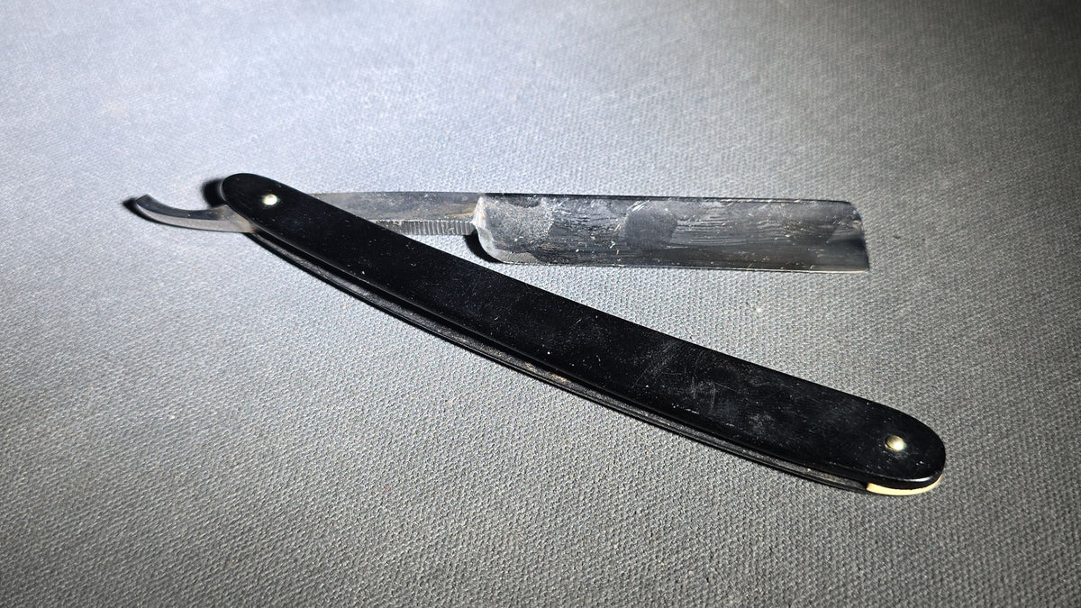 Antique Winchester Trade Mark Straight Razor with Black Scales and Brass Wedge