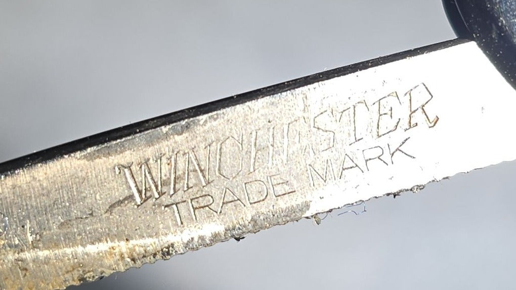 Antique Winchester Trade Mark Straight Razor with Black Scales and Brass Wedge