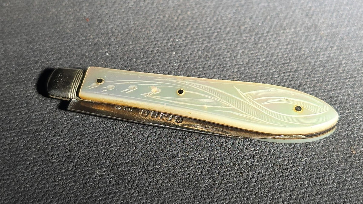 Antique Sterling Silver Folding Pocket Knife with Carved Mother-of-Pearl Handle Scales, Manufactured by Thomas Marples, Sheffield, England, 1878