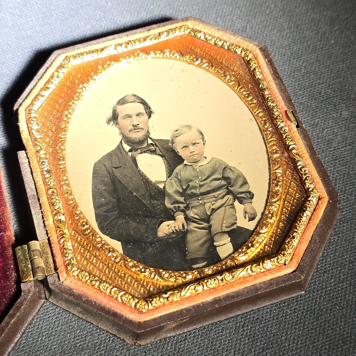 Antique 1/6th Plate Ambrotype Photograph of a Father and Young Son in Thermoplastic Union Case with Winged Cherub and Butterfly Chariot Design