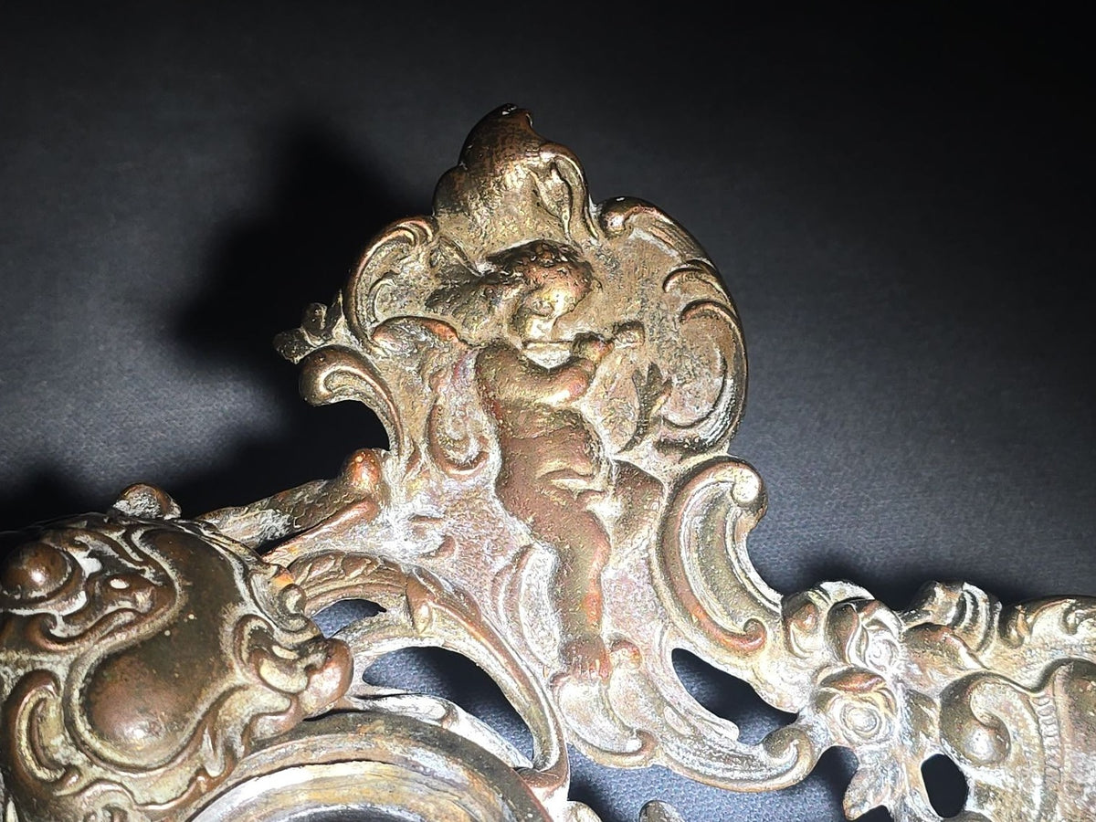 Antique Cast Metal Rococo-Style Inkstand with Cherub Finial, Glass Ink Insert, Hinged Lid, and Shell-Form Pen Tray
