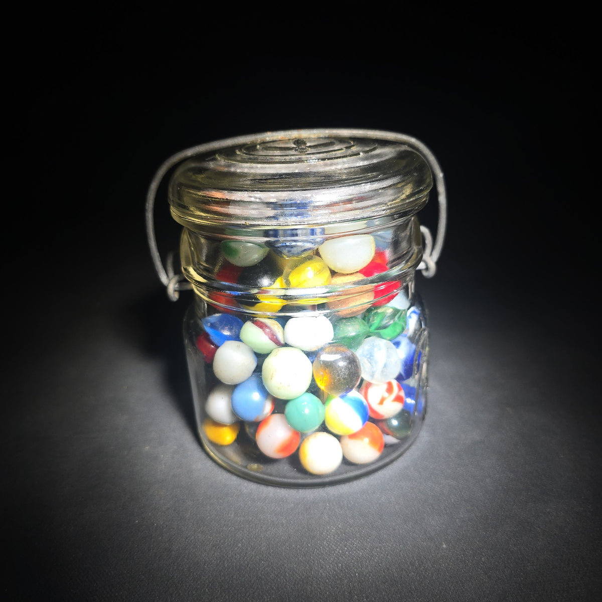 Vintage Glass Marbles in Ball Eclipse Wide Mouth Jar with Wire Bail, including UV-Reactive Uranium Glass Marbles