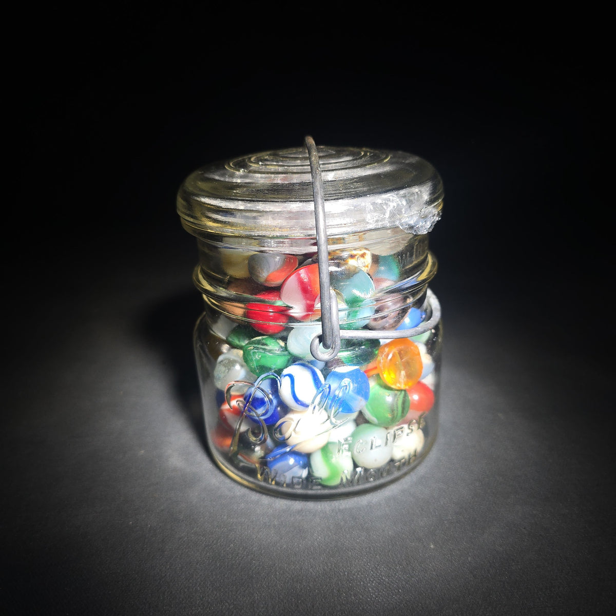 Vintage Glass Marbles in Ball Eclipse Wide Mouth Jar with Wire Bail, including UV-Reactive Uranium Glass Marbles