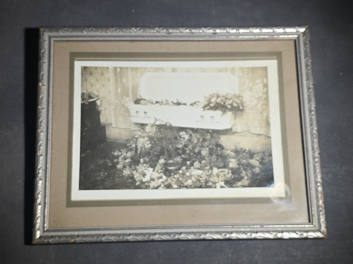 Antique Framed Funeral Photograph of a Child in Open Casket Surrounded by Floral Arrangements