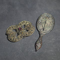 Lot 089 - Pair of Antique Filigree Accessories Including a Brooch with Purple Glass Cabochon and a Miniature Hand Mirror