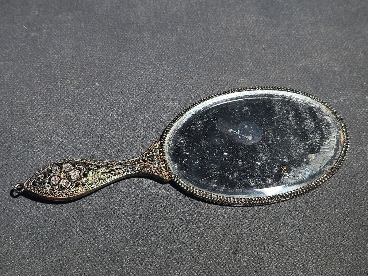Pair of Antique Filigree Accessories including a Brooch with Purple Glass Cabochon and a Miniature Hand Mirror