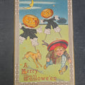 Lot 036 - Antique "A Merry Hallowe'en" Halloween Postcard with Jack-O-Lantern Scarecrows, Boy, and Dog, Postmarked 1915, Addressed to Harmony, Rhode Island