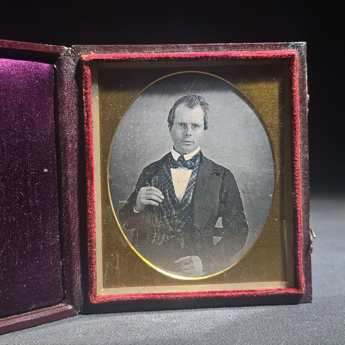 Antique 1/6th Plate Daguerreotype Photograph of a Young Man Wearing a Plaid Vest and Bow Tie in Full Leatherette Case