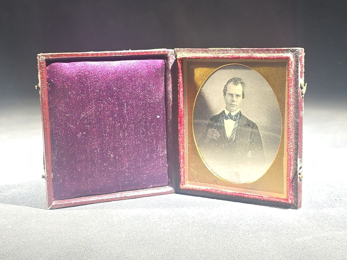Antique 1/6th Plate Daguerreotype Photograph of a Young Man Wearing a Plaid Vest and Bow Tie in Full Leatherette Case