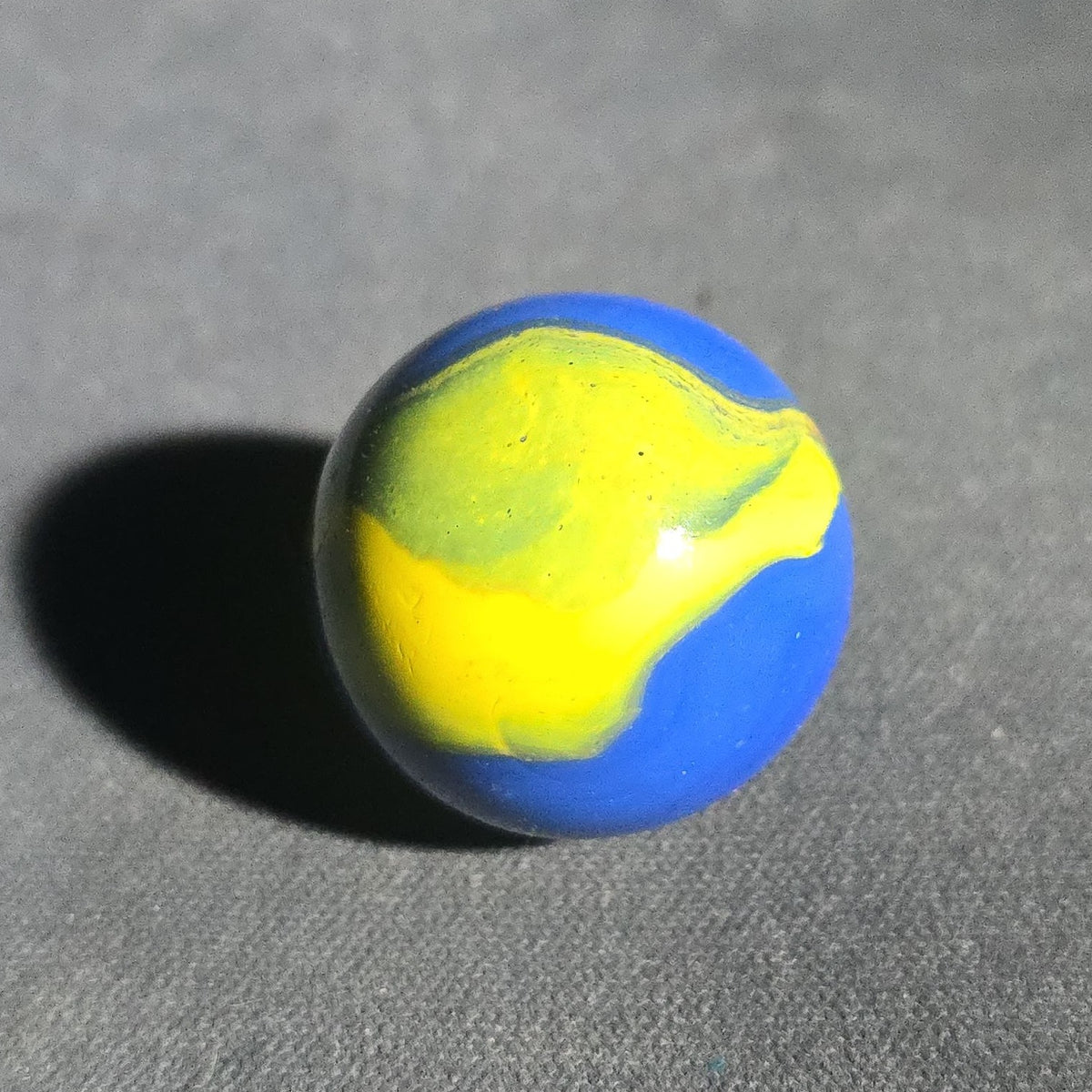 Vintage Blue Opaque Glass Marble with Yellow and Orange Swirls