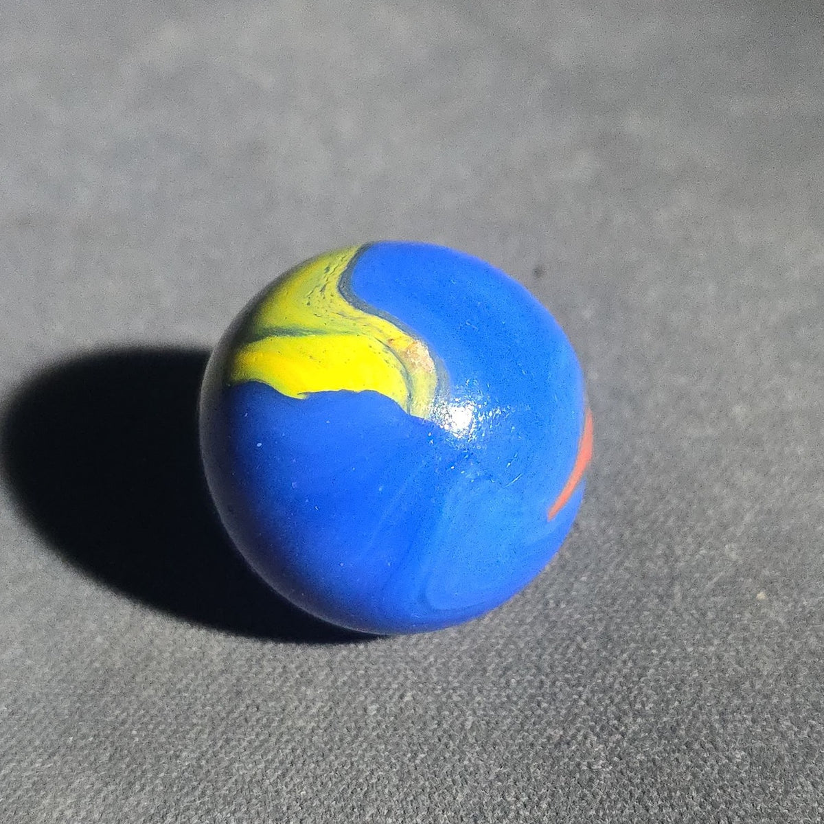 Vintage Blue Opaque Glass Marble with Yellow and Orange Swirls