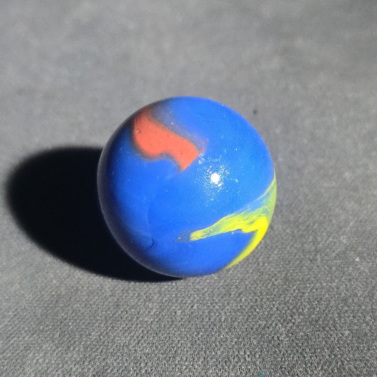 Vintage Blue Opaque Glass Marble with Yellow and Orange Swirls