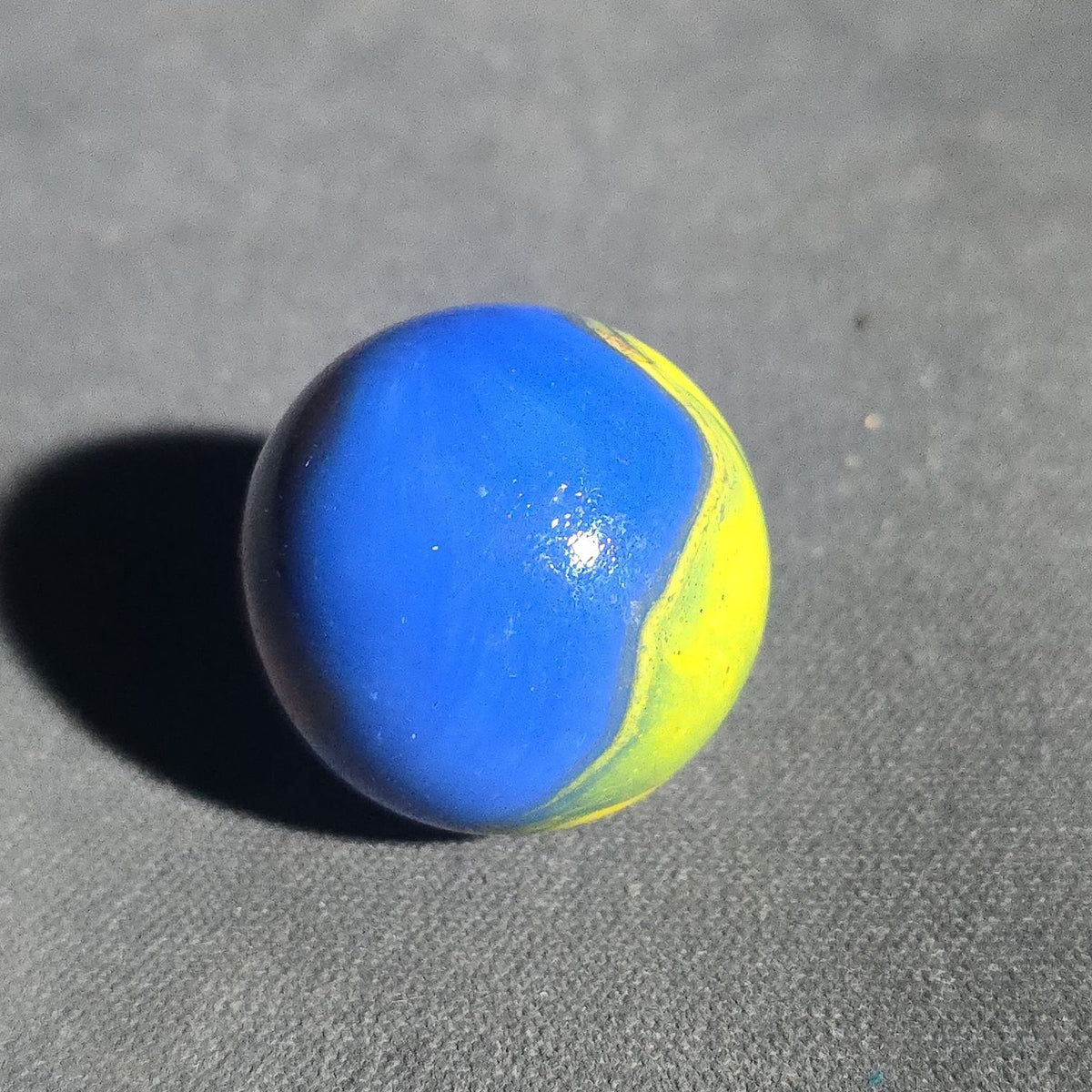 Vintage Blue Opaque Glass Marble with Yellow and Orange Swirls