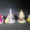 Lot 159 - Grouping of Four Vintage Japanese Santa Claus Christmas Ornaments in Metallic Foil Cone Robes with Pipe Cleaner Arms