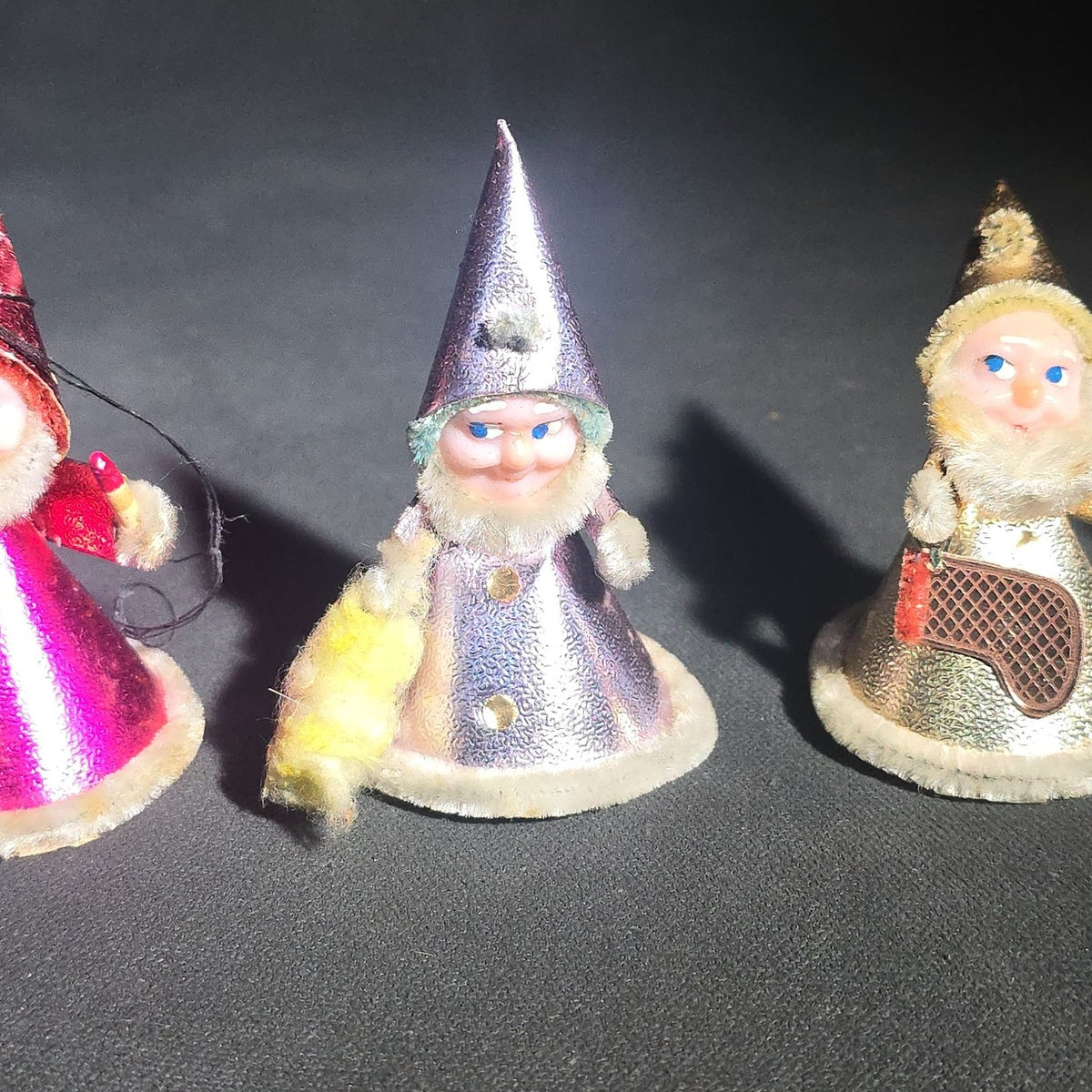 Grouping of Four Vintage Japanese Santa Claus Christmas Ornaments in Metallic Foil Cone Robes with Pipe Cleaner Arms