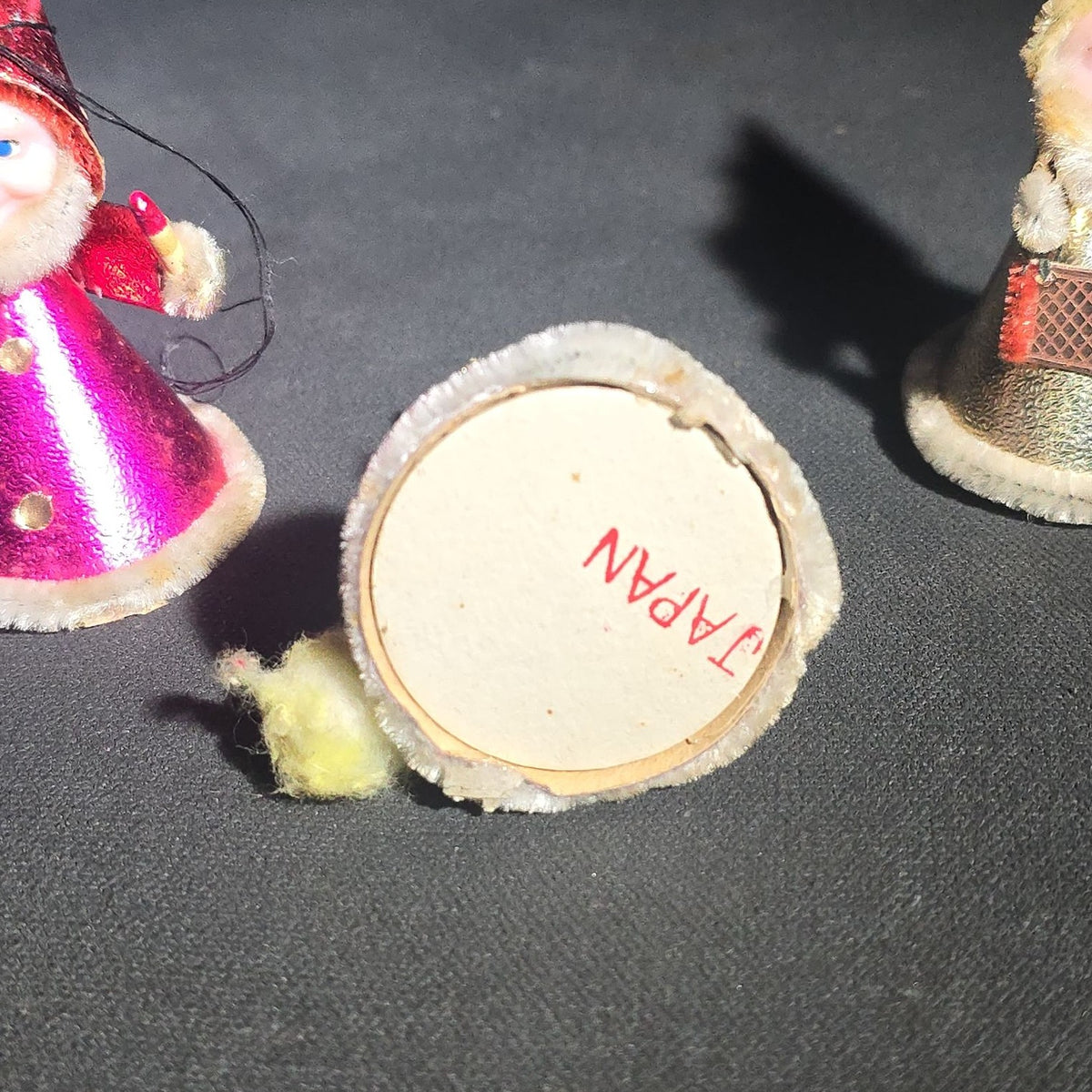 Grouping of Four Vintage Japanese Santa Claus Christmas Ornaments in Metallic Foil Cone Robes with Pipe Cleaner Arms