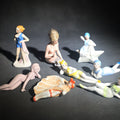 Lot 114 - Grouping of Eight Vintage Porcelain Bathing Beauty and Nude Figurines Including Reclining, Seated, and Standing Poses in Swimsuits and Nude Forms