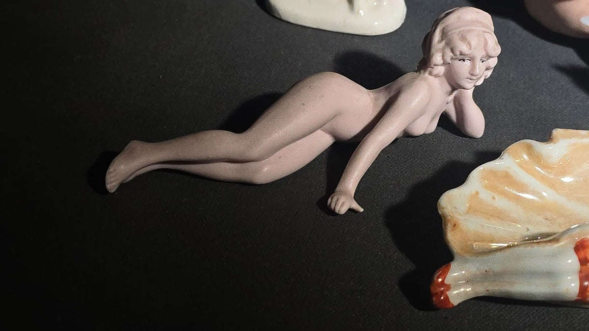 Grouping of Eight Vintage Porcelain Bathing Beauty and Nude Figurines including Reclining, Seated, and Standing Poses in Swimsuits and Nude Forms
