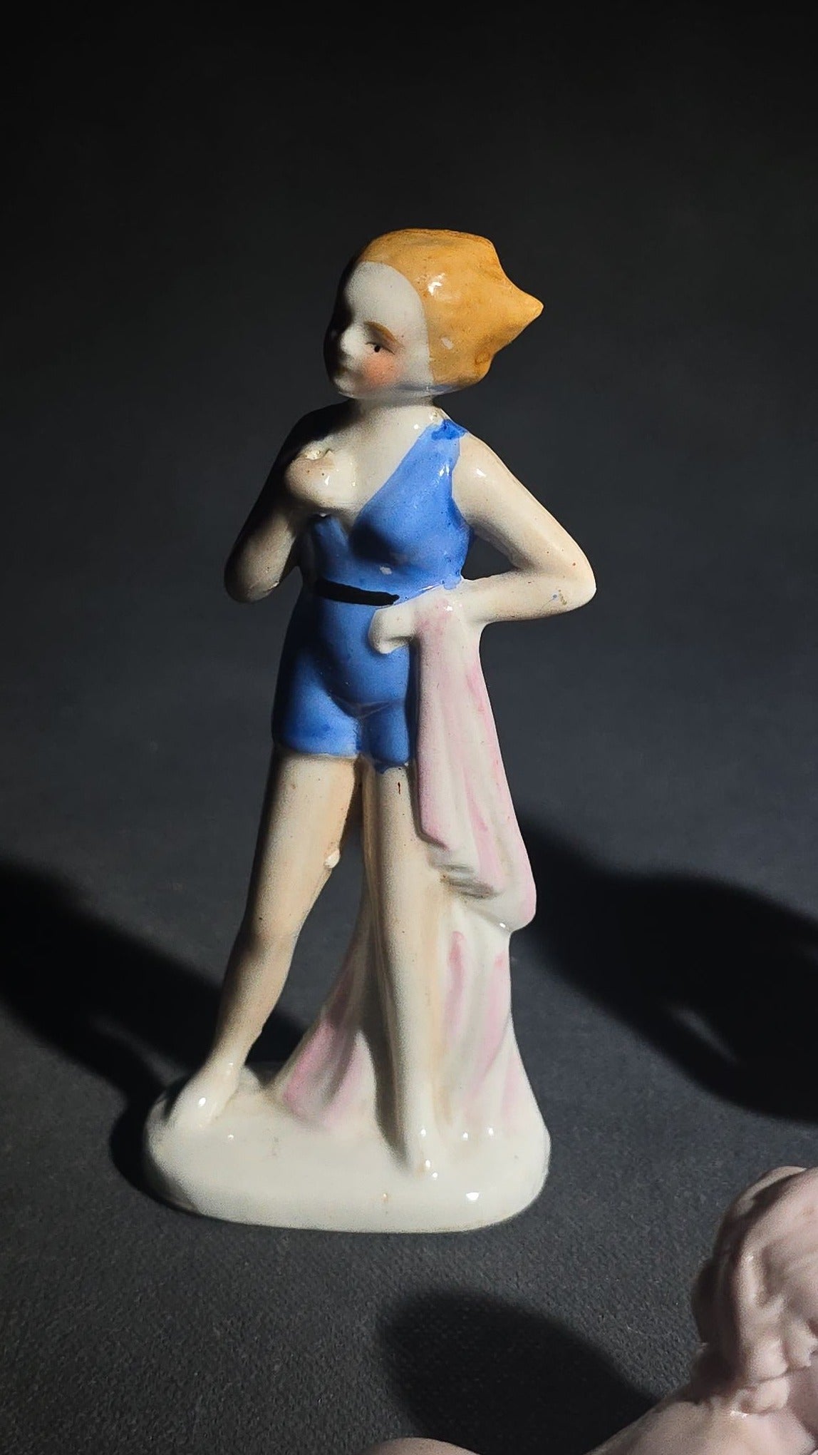 Grouping of Eight Vintage Porcelain Bathing Beauty and Nude Figurines including Reclining, Seated, and Standing Poses in Swimsuits and Nude Forms