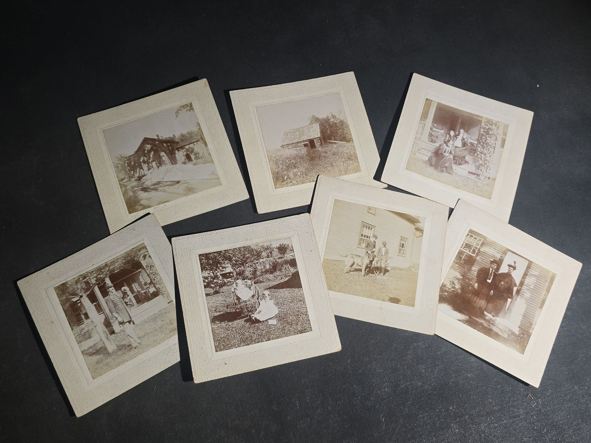 Grouping of Seven Antique Board-Mounted Photographs including Homes, Log Cabin, Children with Dog, and Band Director with Brass Instrument, Proctor, Vermont, Circa 1880s-1890s