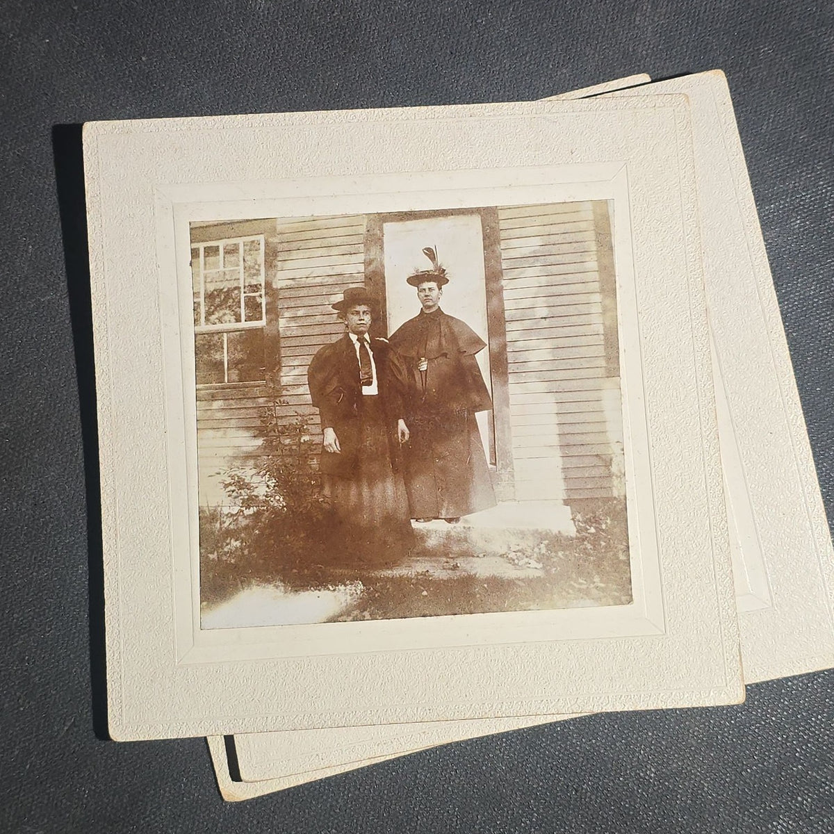 Grouping of Seven Antique Board-Mounted Photographs including Homes, Log Cabin, Children with Dog, and Band Director with Brass Instrument, Proctor, Vermont, Circa 1880s-1890s