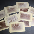 Lot 020 - Grouping of 11 Antique Board-Mounted Photographs, Circa 1890s, Including Woman with Bicycle, Boy with Donkey in Snow, Boy with Dogs, Family Portrait, Women on Porch, and Winter House Scenes