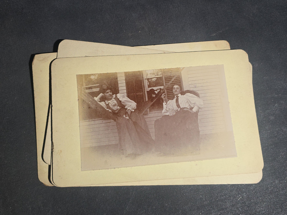 Grouping of 11 Antique Board-Mounted Photographs, Circa 1890s, including Woman with Bicycle, Boy with Donkey in Snow, Boy with Dogs, Family Portrait, Women on Porch, and Winter House Scenes