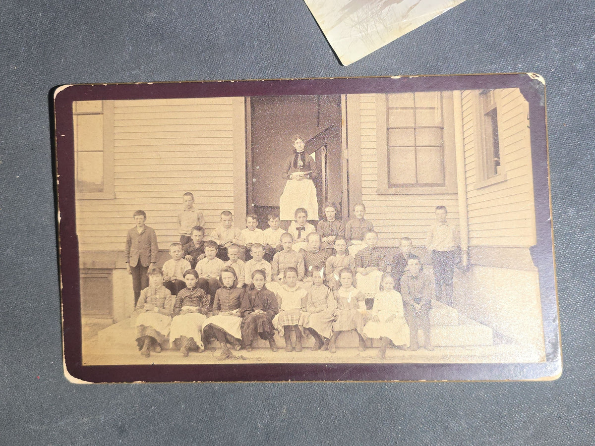 Grouping of Seven Antique Photographs including Board-Mounted Horse and Buggy, Oval-Cropped Barn, School Class with Names Inscribed, Large Victorian Building, "The Ormsbee House," Two Children with Birdcage, and Winter Hilltop View