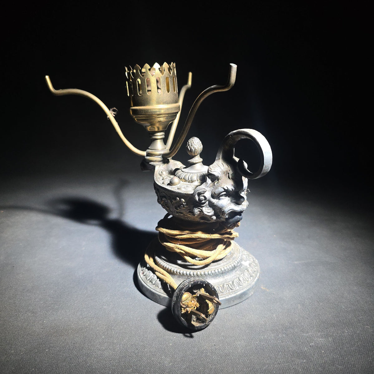 Antique Cast Metal Aladdin Lamp Form Electric Table Lamp with Grotesque Face and Scrollwork on Weighted Base