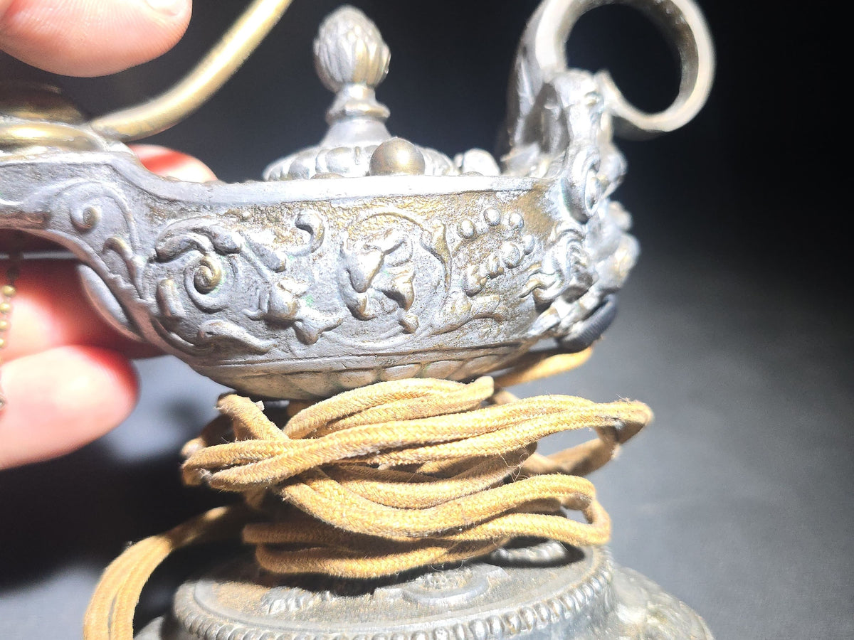 Antique Cast Metal Aladdin Lamp Form Electric Table Lamp with Grotesque Face and Scrollwork on Weighted Base
