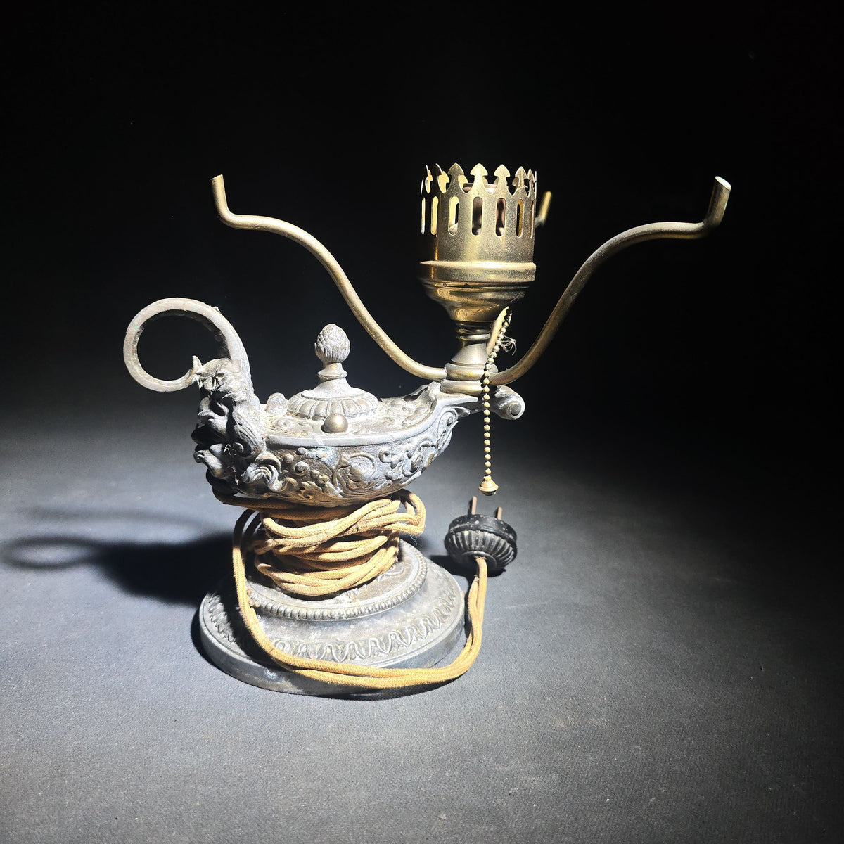 Antique Cast Metal Aladdin Lamp Form Electric Table Lamp with Grotesque Face and Scrollwork on Weighted Base