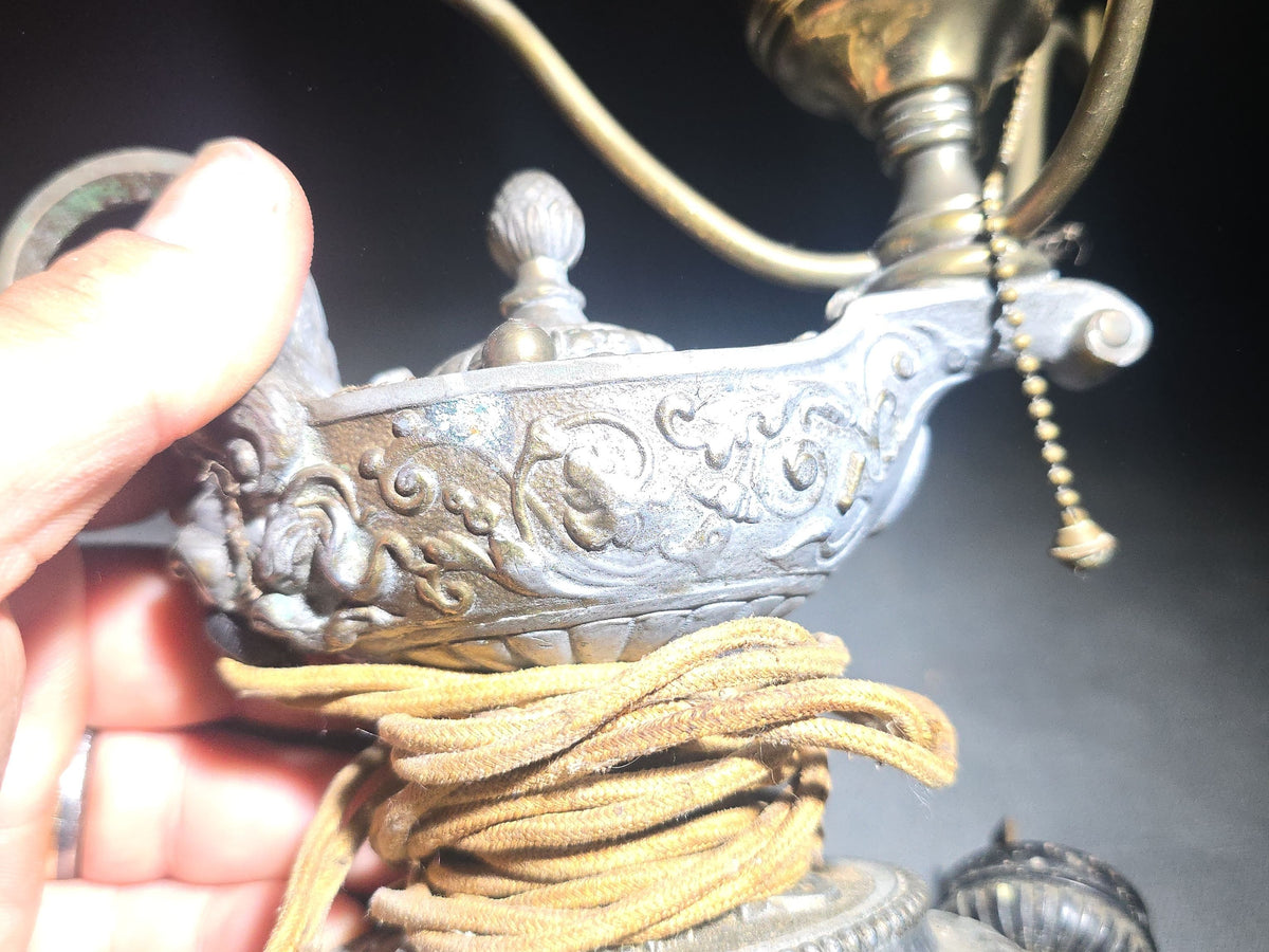 Antique Cast Metal Aladdin Lamp Form Electric Table Lamp with Grotesque Face and Scrollwork on Weighted Base