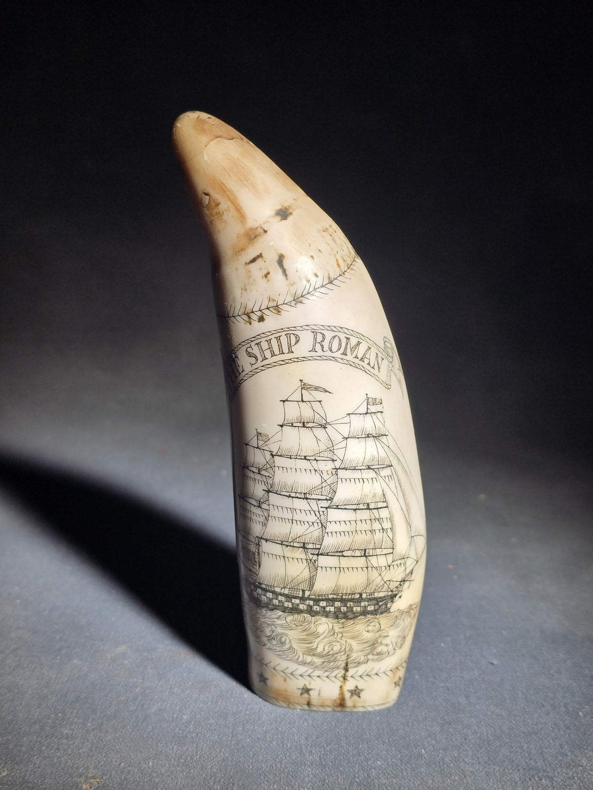 Modern Faux Scrimshaw Resin Whale Tooth, "The Ship Roman" with Full-Rigged Ship and Sailor Holding American Flag