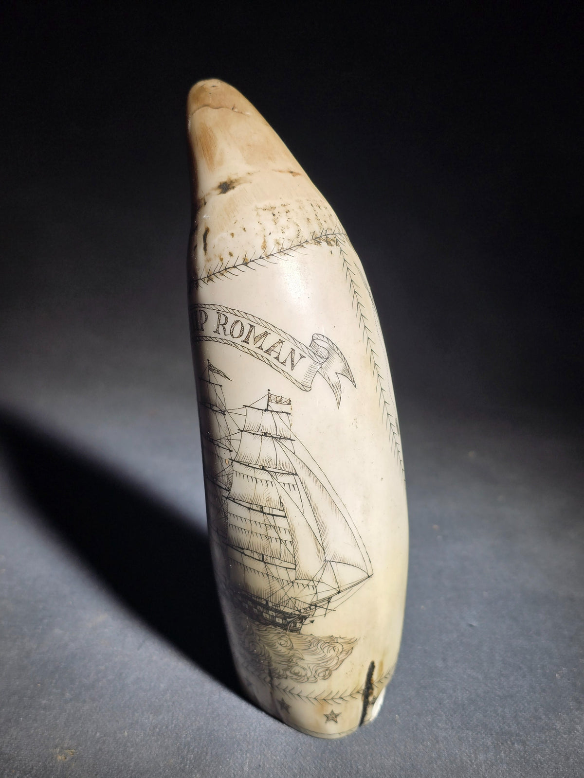 Modern Faux Scrimshaw Resin Whale Tooth, "The Ship Roman" with Full-Rigged Ship and Sailor Holding American Flag