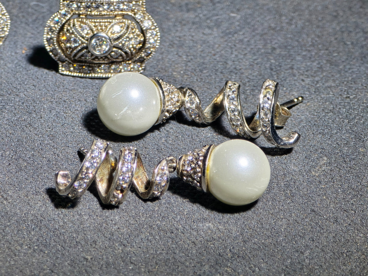 Grouping of Three Pairs of Vintage Sterling Silver Earrings including Filigree Clip-Ons with Clear Stones, Spiral Drop Earrings with Faux Pearls, and Brushed Dome Studs with Center Stones