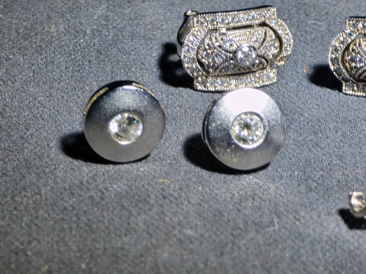 Grouping of Three Pairs of Vintage Sterling Silver Earrings including Filigree Clip-Ons with Clear Stones, Spiral Drop Earrings with Faux Pearls, and Brushed Dome Studs with Center Stones
