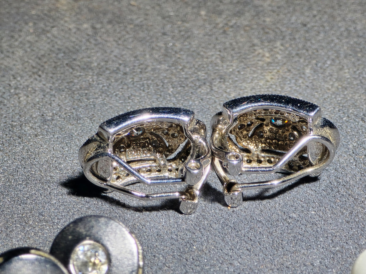 Grouping of Three Pairs of Vintage Sterling Silver Earrings including Filigree Clip-Ons with Clear Stones, Spiral Drop Earrings with Faux Pearls, and Brushed Dome Studs with Center Stones