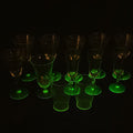 Lot 159 - Grouping of 12 Antique Uranium Glass Drinking Vessels with Etched Stemware and Tumblers