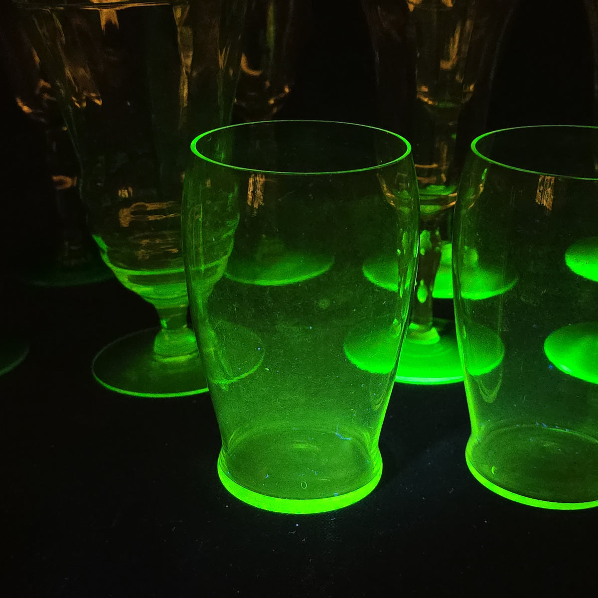 Grouping of 12 Antique Uranium Glass Drinking Vessels with Etched Stemware and Tumblers