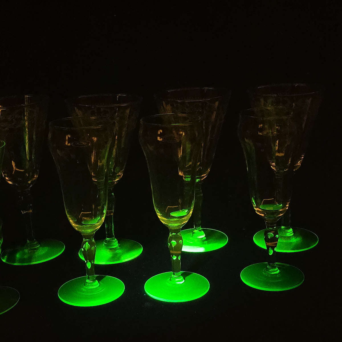 Grouping of 12 Antique Uranium Glass Drinking Vessels with Etched Stemware and Tumblers