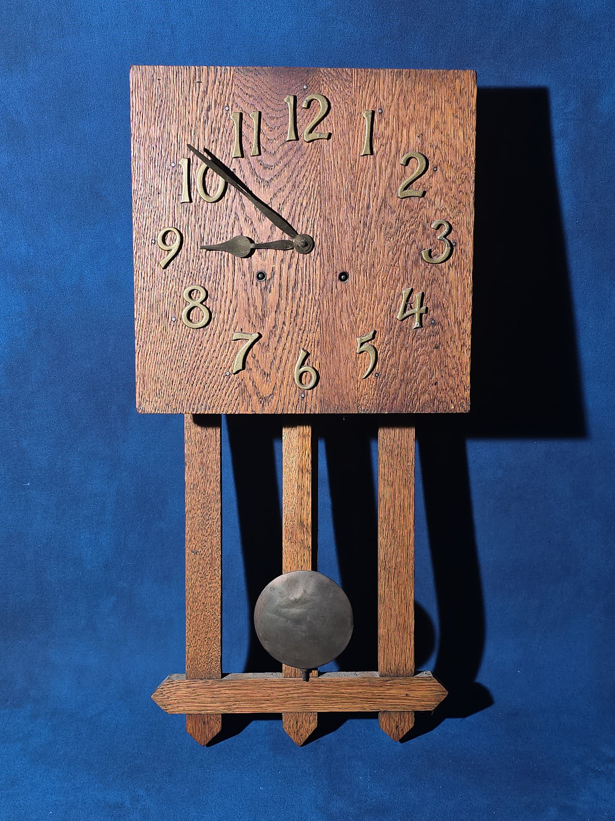Antique Arts and Crafts Oak Wall Clock with Pendulum and Brass Numerals