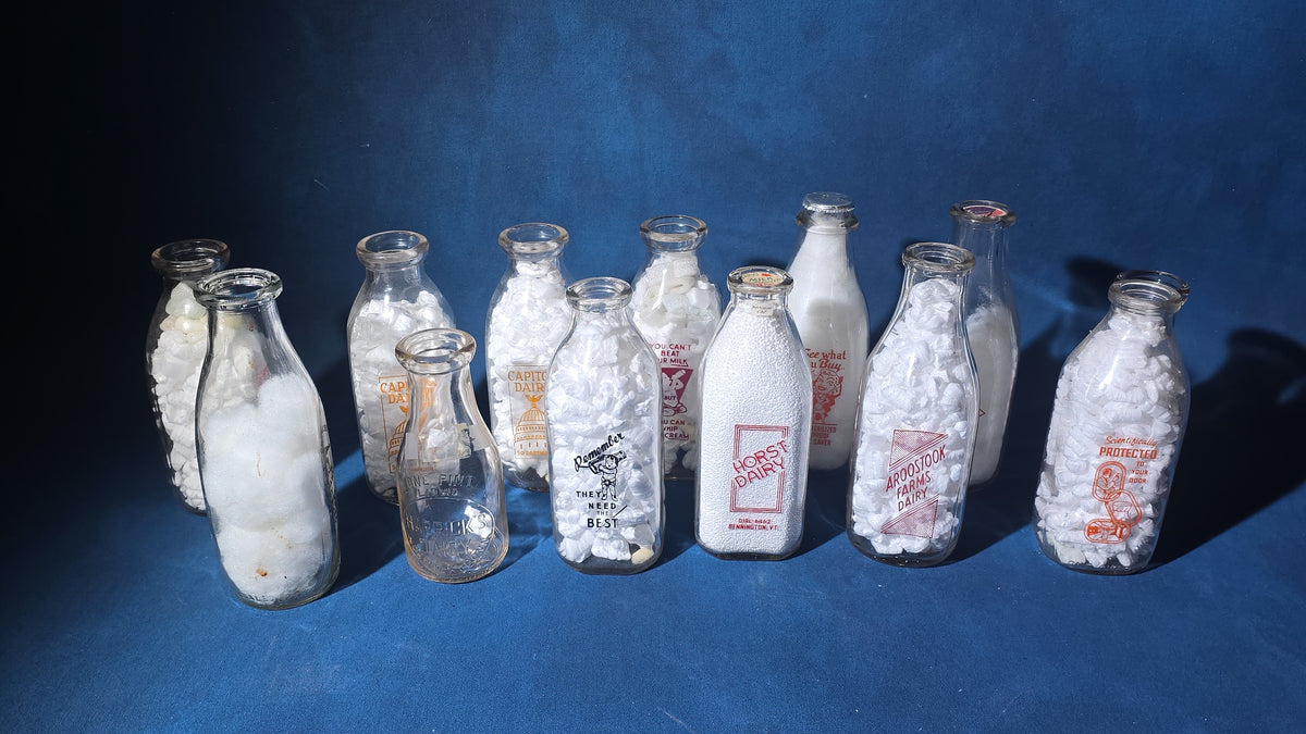 Grouping of 13 Vintage Printed Glass Dairy Milk Bottles including Capitol Dairy, Horst Dairy, Aroostook Farms, Sanford Dairy, Rice's, Findeisen's Farms, and Others